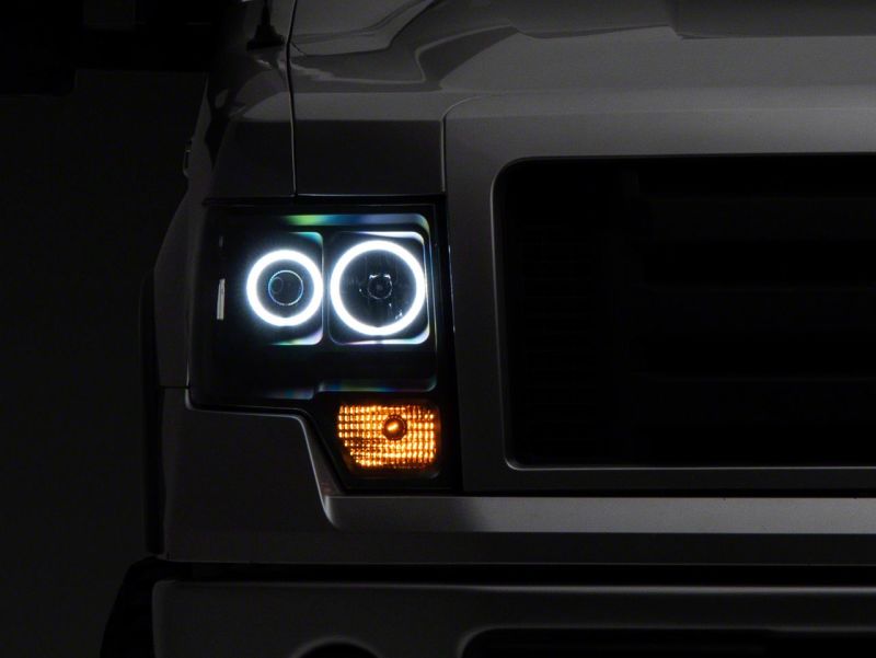 Raxiom 09-14 Ford F-150 Super White LED Halo Proyector Faros delanteros - Carcasa negra (lente transparente)