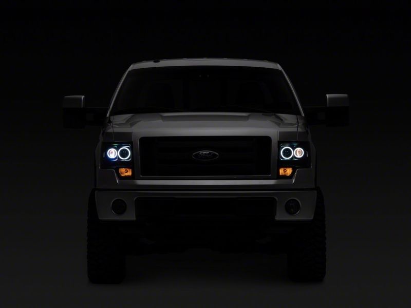 Raxiom 09-14 Ford F-150 Super White LED Halo Proyector Faros delanteros - Carcasa negra (lente transparente)