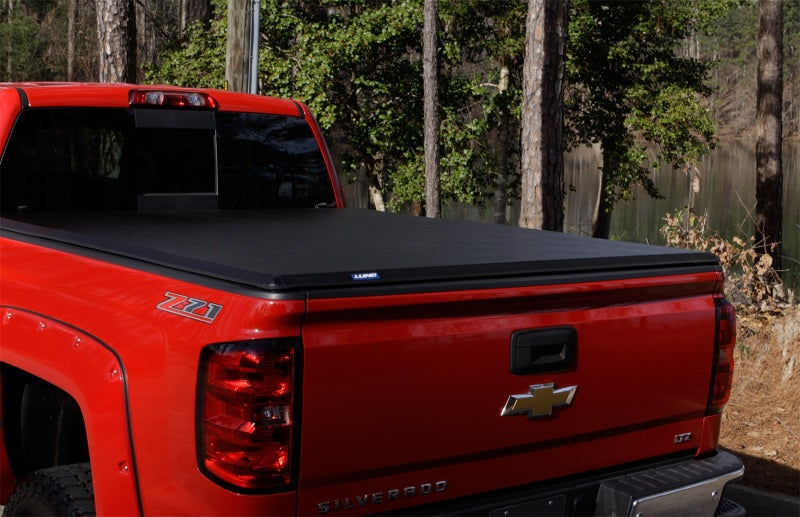 Lund 09-14 Ford F-150 Styleside (6.5ft. Bed) Hard Fold Tonneau Cover - Black