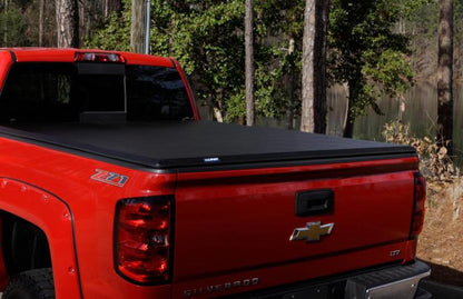 Lund 09-14 Ford F-150 Styleside (6.5ft. Bed) Hard Fold Tonneau Cover - Black